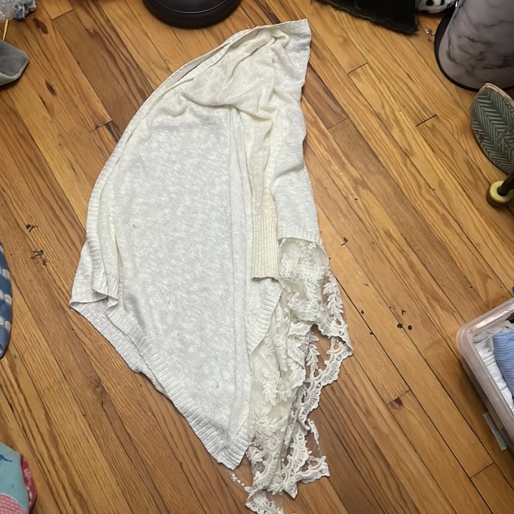 Rue 21 cardigan women’s size medium. Has white flowers at the bottom. Worn once.